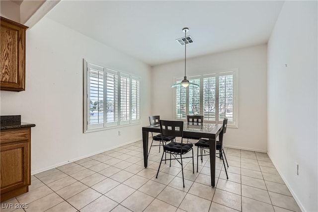 7465 Widewing Dr, North Las Vegas, NV 89084 - dining room featuring light tile patterned floors, baseboards, and ceiling fan
