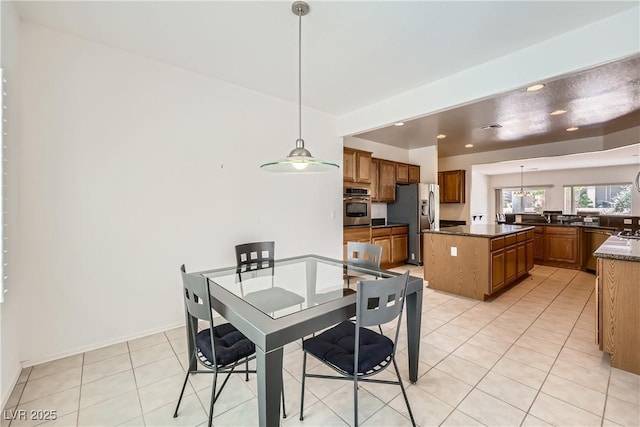 7465 Widewing Dr, North Las Vegas, NV 89084 - dining area with light tile patterned floors and recessed lighting
