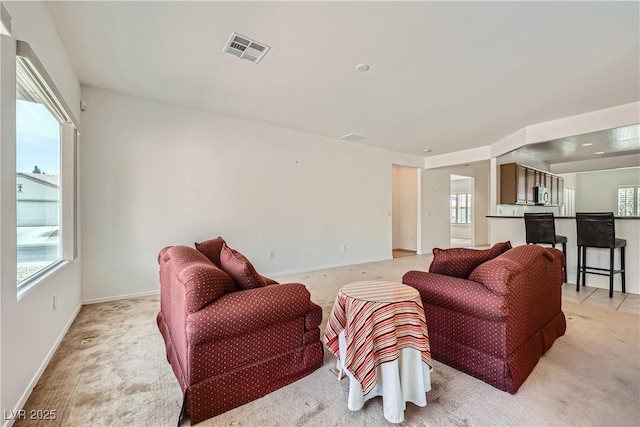7465 Widewing Dr, North Las Vegas, NV 89084 - living room with light colored carpet and baseboards