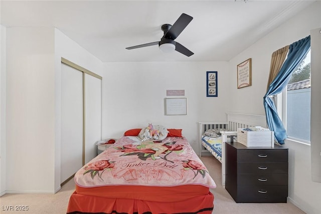 3481 Creek River Dr, Las Vegas, NV 89129 - bedroom featuring light colored carpet, a closet, a ceiling fan, and baseboards