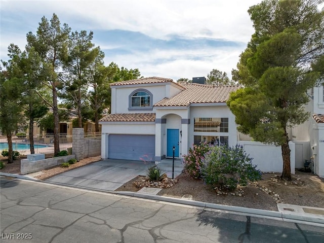 3481 Creek River Dr, Las Vegas, NV 89129 - mediterranean / spanish house featuring stucco siding, a tile roof, driveway, and a garage