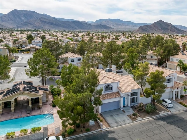 3481 Creek River Dr, Las Vegas, NV 89129 - aerial perspective of suburban area featuring a mountainous background and a pool area