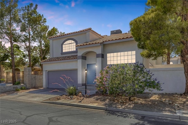 3481 Creek River Dr, Las Vegas, NV 89129 - mediterranean / spanish-style house featuring driveway, a garage, stucco siding, and a tiled roof