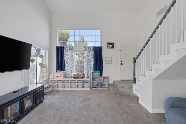 3481 Creek River Dr, Las Vegas, NV 89129 - carpeted foyer with stairs and a towering ceiling