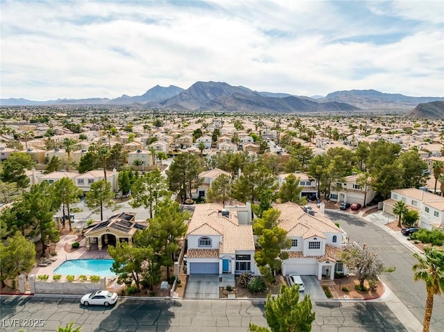 3481 Creek River Dr, Las Vegas, NV 89129 - aerial perspective of suburban area with mountains and a pool