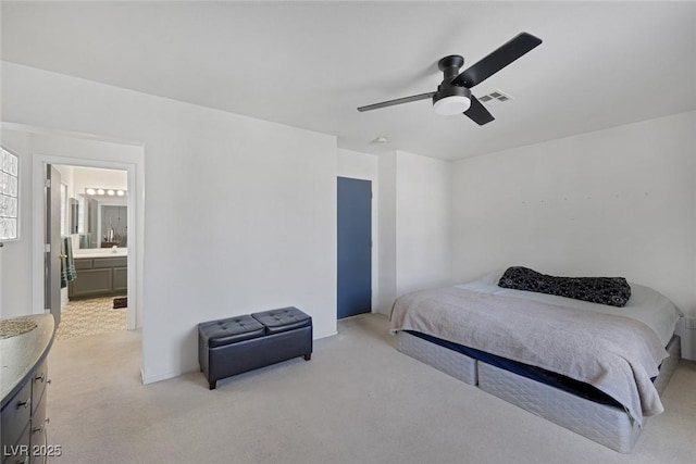 3481 Creek River Dr, Las Vegas, NV 89129 - bedroom featuring light colored carpet, a ceiling fan, and connected bathroom