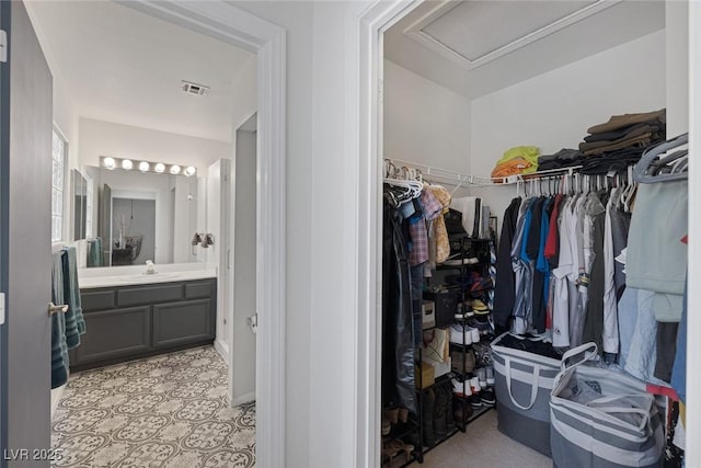 3481 Creek River Dr, Las Vegas, NV 89129 - walk in closet featuring attic access