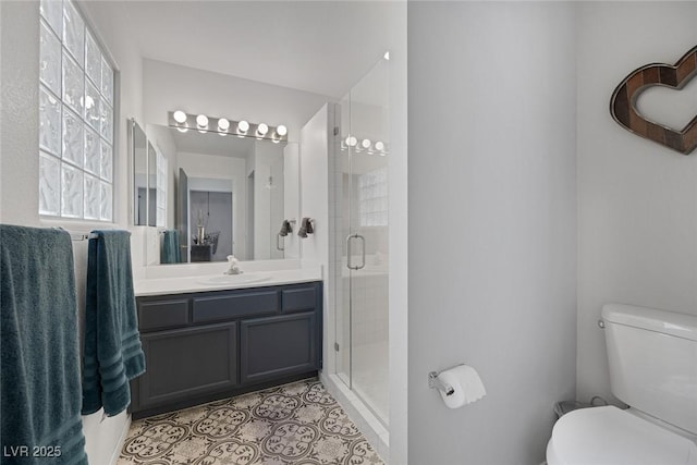 3481 Creek River Dr, Las Vegas, NV 89129 - bathroom featuring vanity, toilet, a shower stall, and tile patterned flooring