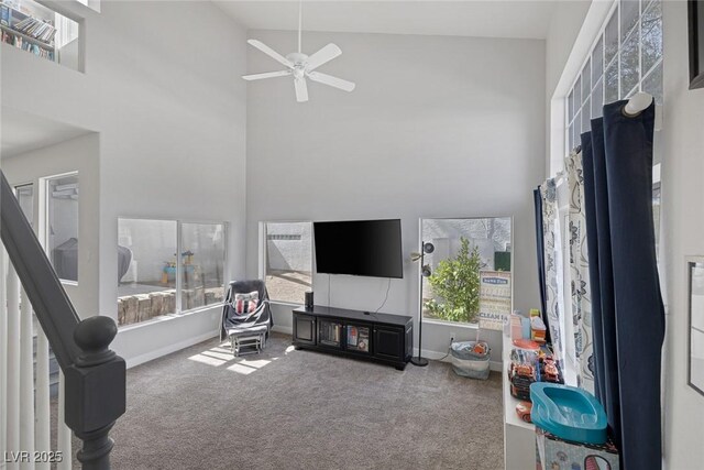 3481 Creek River Dr, Las Vegas, NV 89129 - carpeted living room with a towering ceiling, ceiling fan, and baseboards