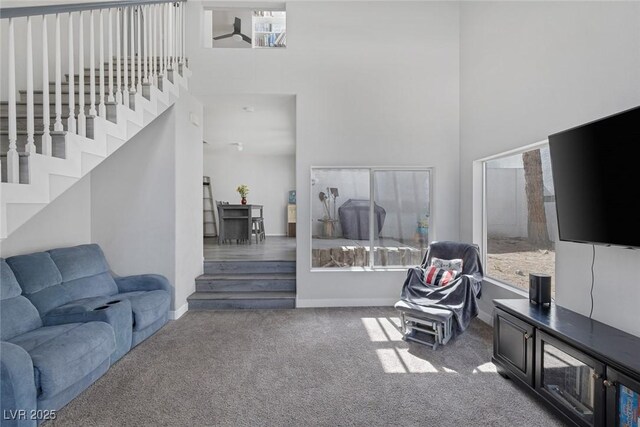 3481 Creek River Dr, Las Vegas, NV 89129 - living area featuring a high ceiling, carpet floors, and baseboards