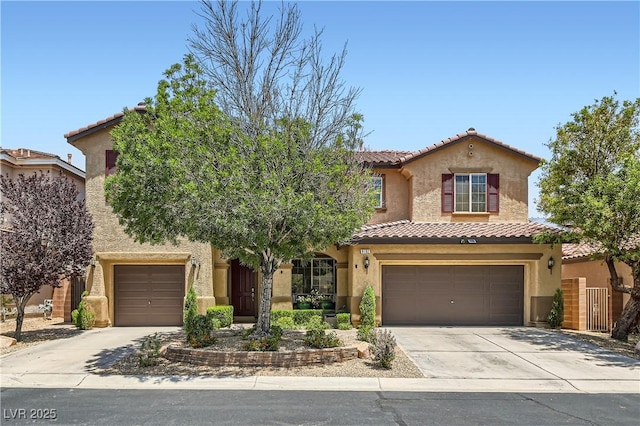 9192 Moose Country Pl, Las Vegas, NV 89178 - mediterranean / spanish-style house featuring driveway, a tiled roof, stucco siding, and an attached garage