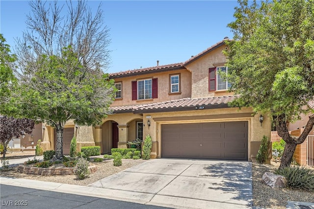 9192 Moose Country Pl, Las Vegas, NV 89178 - mediterranean / spanish home with a tile roof, stucco siding, driveway, and an attached garage