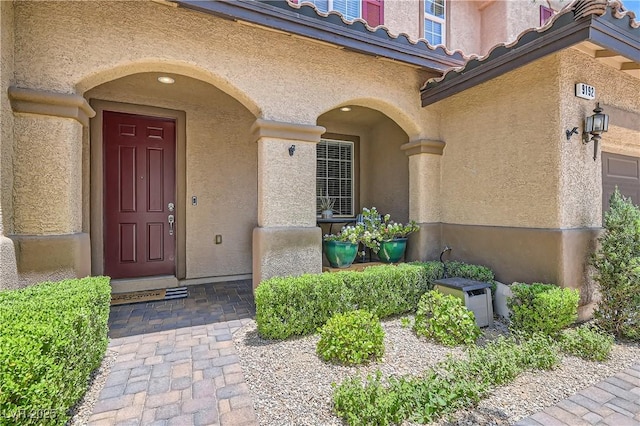 9192 Moose Country Pl, Las Vegas, NV 89178 - property entrance with stucco siding and a tile roof