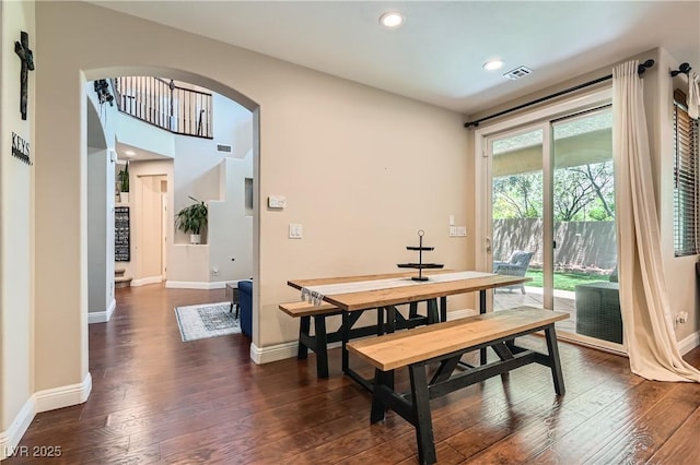 9192 Moose Country Pl, Las Vegas, NV 89178 - dining space with arched walkways, baseboards, dark wood-type flooring, and recessed lighting