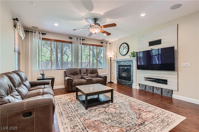 9192 Moose Country Pl, Las Vegas, NV 89178 - living area featuring a ceiling fan, baseboards, a fireplace, wood finished floors, and recessed lighting