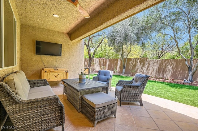 9192 Moose Country Pl, Las Vegas, NV 89178 - fenced backyard with a ceiling fan, a patio, and an outdoor hangout area