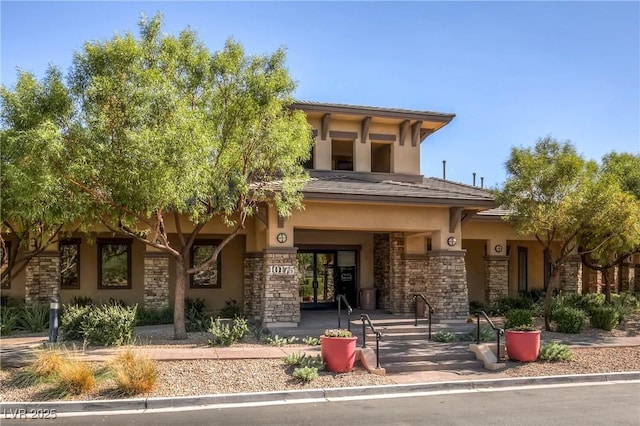 9192 Moose Country Pl, Las Vegas, NV 89178 - view of front of property with stone siding and stucco siding