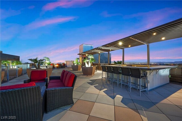 11441 Allerton Park Dr Unit 212, Las Vegas, NV 89135 - patio terrace at dusk with a patio and an outdoor hangout area