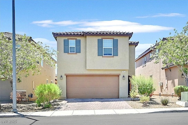8755 Spanish Ridge Ave, Las Vegas, NV 89148 - view of front of house with stucco siding, a garage, and a tiled roof