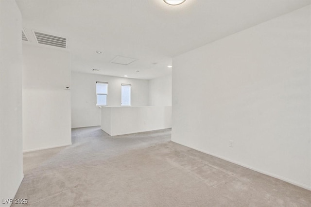 8755 Spanish Ridge Ave, Las Vegas, NV 89148 - spare room featuring light carpet, attic access, and recessed lighting