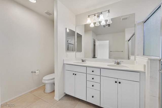 8755 Spanish Ridge Ave, Las Vegas, NV 89148 - bathroom with double vanity, tile patterned flooring, toilet, and baseboards
