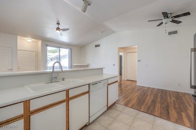 4960 Harrison Dr Unit 214, Las Vegas, NV 89120 - kitchen with white dishwasher, ceiling fan, a sink, vaulted ceiling, and light countertops