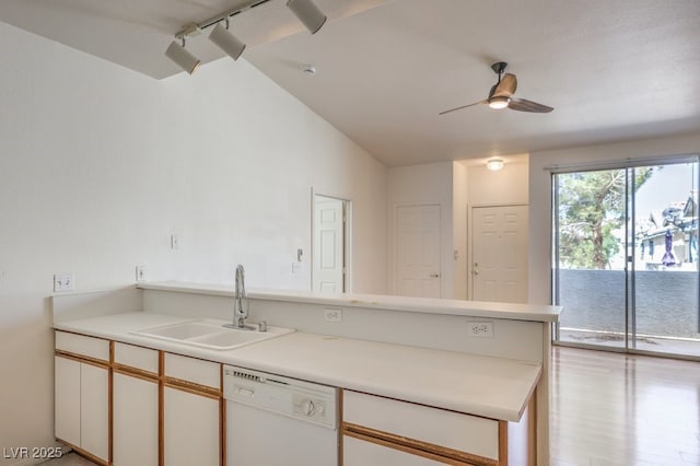 4960 Harrison Dr Unit 214, Las Vegas, NV 89120 - kitchen featuring white dishwasher, a sink, a peninsula, ceiling fan, and vaulted ceiling