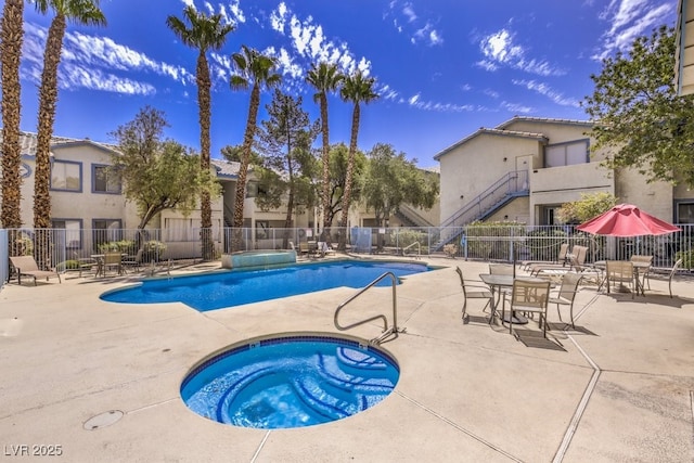 4960 Harrison Dr Unit 214, Las Vegas, NV 89120 - community pool with a hot tub and a patio area
