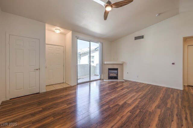 4960 Harrison Dr Unit 214, Las Vegas, NV 89120 - unfurnished living room with lofted ceiling, wood finished floors, ceiling fan, a fireplace, and baseboards