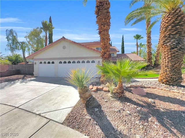 8632 Skyward Ct, Las Vegas, NV 89145 - view of front of home with driveway, a garage, and a tile roof