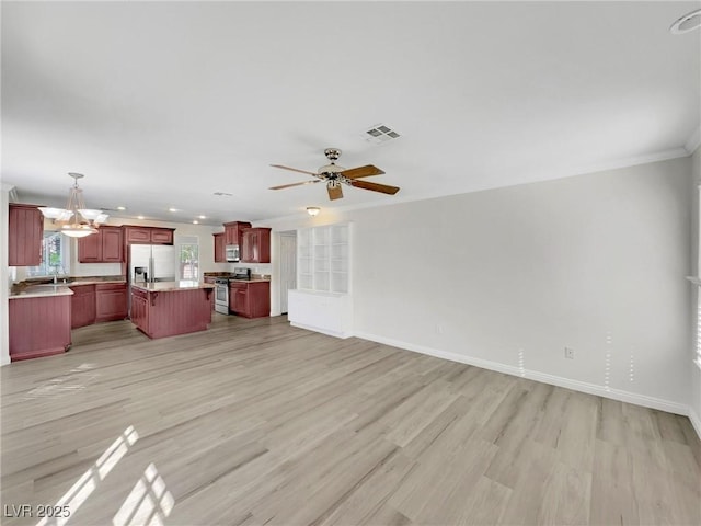 8632 Skyward Ct, Las Vegas, NV 89145 - unfurnished living room featuring light wood-type flooring, a chandelier, baseboards, ornamental molding, and ceiling fan
