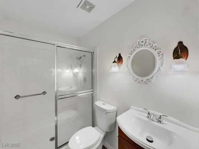 8632 Skyward Ct, Las Vegas, NV 89145 - bathroom featuring a shower stall, toilet, and vanity