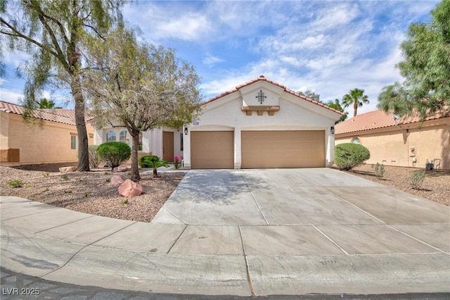 4176 Demoline Cir, Las Vegas, NV 89141 - mediterranean / spanish home with a garage, stucco siding, driveway, and a tiled roof