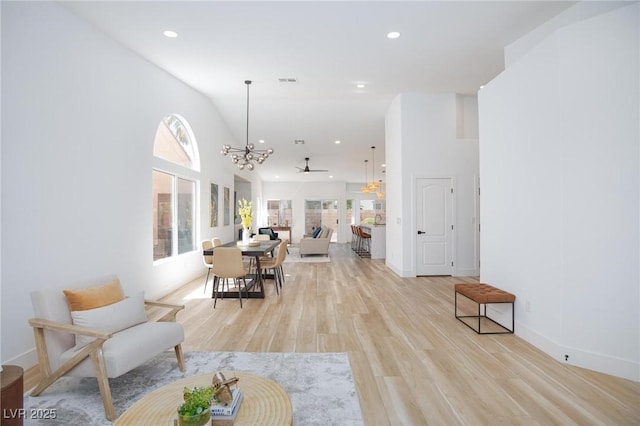 4176 Demoline Cir, Las Vegas, NV 89141 - living area featuring a chandelier, light wood finished floors, and recessed lighting