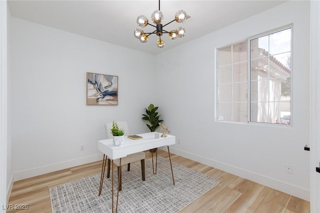 4176 Demoline Cir, Las Vegas, NV 89141 - office with a chandelier and light wood-style floors