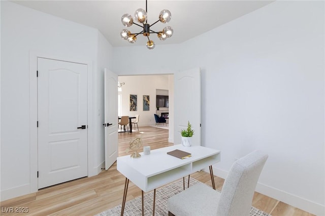 4176 Demoline Cir, Las Vegas, NV 89141 - office featuring a chandelier and light wood-style floors