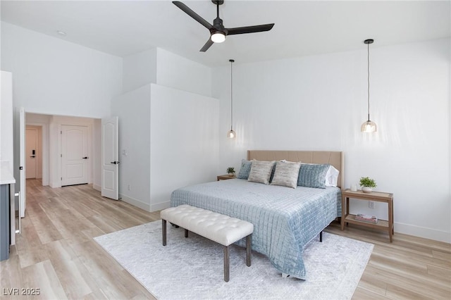 4176 Demoline Cir, Las Vegas, NV 89141 - bedroom with a towering ceiling, light wood-style floors, and a ceiling fan