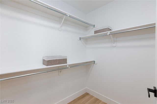 4176 Demoline Cir, Las Vegas, NV 89141 - walk in closet featuring light wood-style flooring