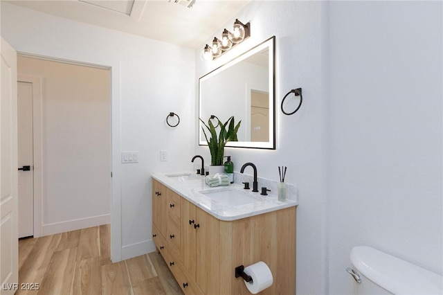 4176 Demoline Cir, Las Vegas, NV 89141 - bathroom with wood finished floors and double vanity