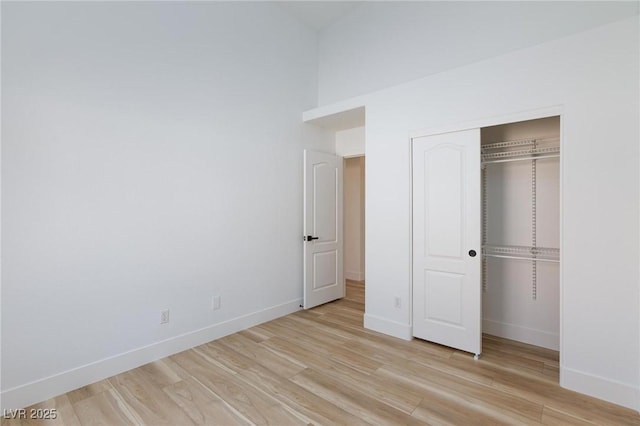 4176 Demoline Cir, Las Vegas, NV 89141 - unfurnished bedroom with light wood finished floors and a closet