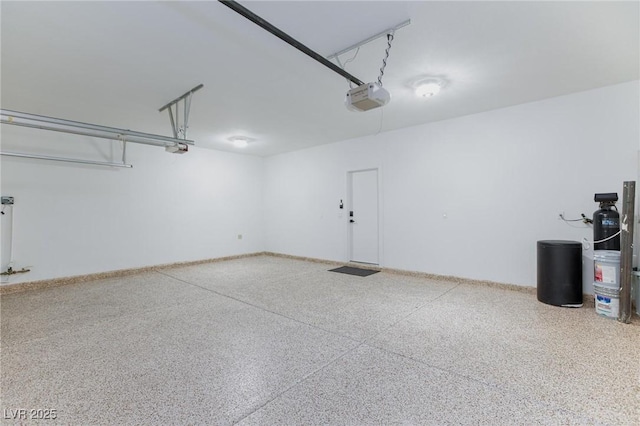 4176 Demoline Cir, Las Vegas, NV 89141 - garage with a garage door opener and baseboards