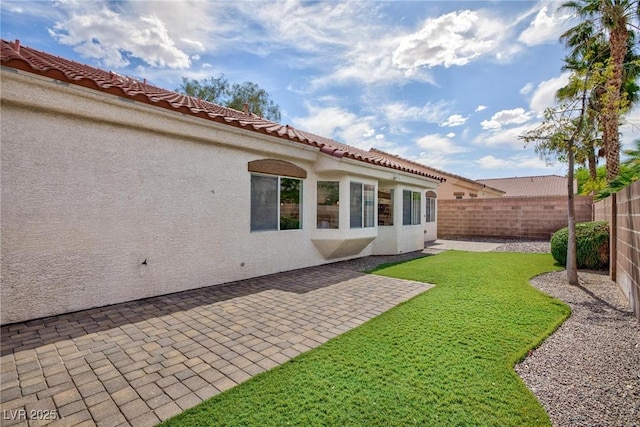 4176 Demoline Cir, Las Vegas, NV 89141 - rear view of property with stucco siding and a patio