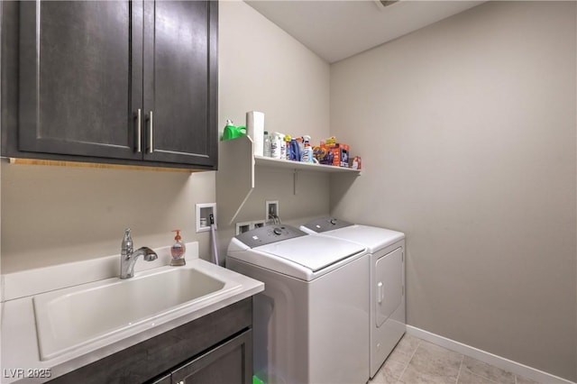 2711 Evolutionary Ln, Las Vegas, NV 89138 - laundry room with separate washer and dryer, cabinet space, baseboards, and light tile patterned flooring
