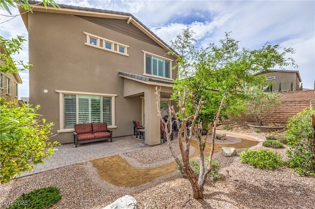 2711 Evolutionary Ln, Las Vegas, NV 89138 - rear view of house with a patio area and stucco siding
