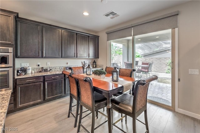 2711 Evolutionary Ln, Las Vegas, NV 89138 - dining room with light wood-type flooring, recessed lighting, and baseboards
