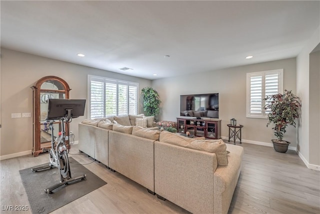 2711 Evolutionary Ln, Las Vegas, NV 89138 - living room featuring plenty of natural light, light wood-style floors, recessed lighting, and baseboards