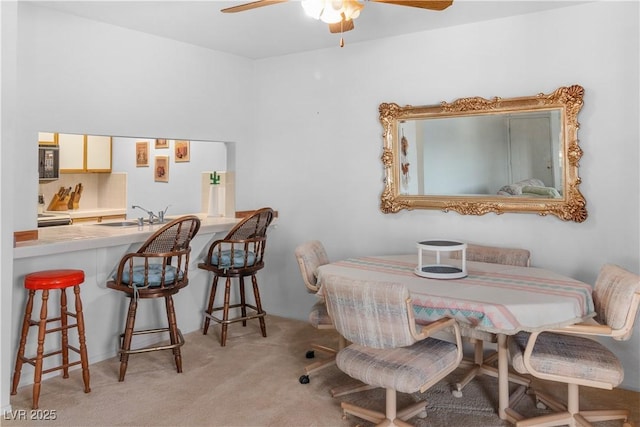 1928 Las Palmas Ln Unit 228, Laughlin, NV 89029 - dining area with carpet flooring and ceiling fan