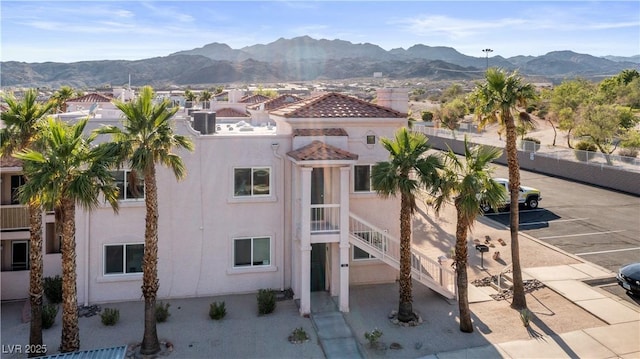 1928 Las Palmas Ln Unit 228, Laughlin, NV 89029 - view of building exterior featuring a mountain view and uncovered parking