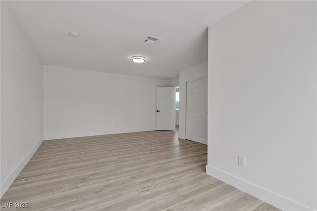 4404 Hillcrest Ave, Las Vegas, NV 89102 - unfurnished room with light wood finished floors, baseboards, and a smoke detector
