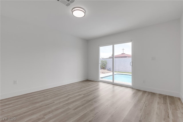 4404 Hillcrest Ave, Las Vegas, NV 89102 - unfurnished room with light wood finished floors and baseboards